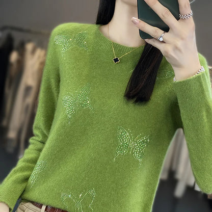 Damesweater med sommerfugledetaljer
